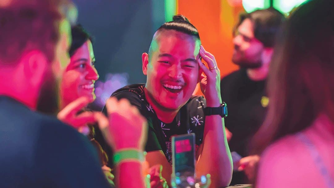 Players at the Fortress gaming lounge under neon lighting